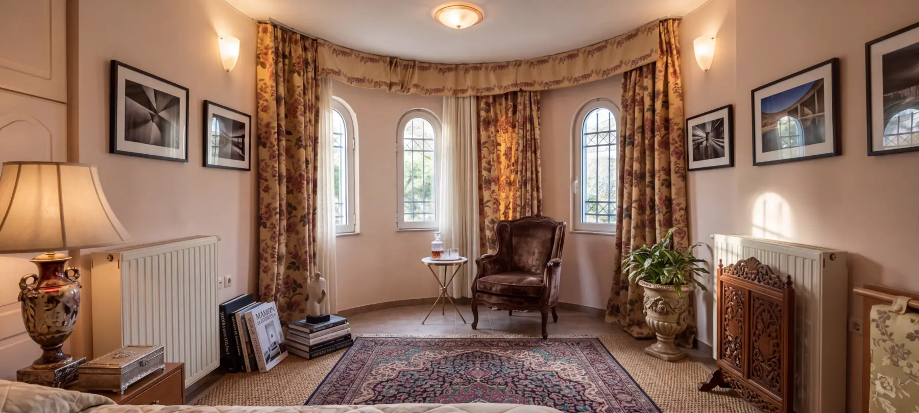 Private bedroom sitting area with arched windows